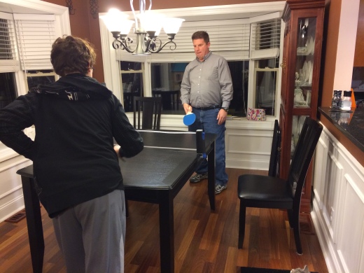 Greg playing ping pong with our son